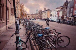 bicycles parked on sidewalk near buildings during daytime