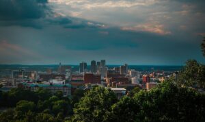 a city with trees and clouds