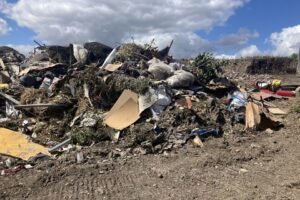Waste illegally dumped on a farm in Cheshire, photo courtesy of Environment Agency